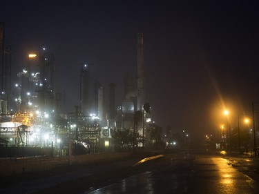A Valero oil refinery's flare continues to burn as Hurricane Harvey makes landfall in Corpus Christi, Texas, on Friday, Aug. 25, 2017. Hurricane Harvey smashed into Texas late Friday, lashing a wide swath of the Gulf Coast with strong winds and torrential rain from the fiercest hurricane to hit the U.S. in more than a decade. (Nick Wagner/Austin American-Statesman via AP) ORG XMIT: TXAUS110