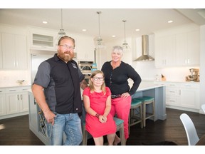 Jan Greik and Lori Collier-Greik  with Porsche in their home in Boulder Creek Estates in  Langdon.