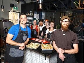 Jared Salekin and Head Chef Keith Geddes with staff from Madison's 1212.