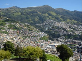 Quito City Shot -- Surrounded by the Andes, Quito is the second highest capital city in the world at 2850 metres. Credit, Greg Olsen.