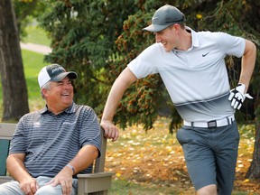 Senior PGA pro Kenny Perry jokes with Flames defenceman Michael Stone during the Pro-Am at the Shaw Charity Classic Wednesday.