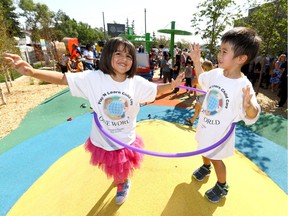 Postmedia Calgary

L-R, Daniella and David both 4 from Play N Learn Child Care attend as the Calgary Public Library held an  official grand opening at the Forest Lawn Library?s Nature Playground. A first-of-its-kind outdoor learning centre with a picnic and storytime in Calgary on Wednesday August 9, 2017. Darren Makowichuk/Postmedia

Postmedia Calgary
Darren Makowichuk, DARREN MAKOWICHUK/Postmedia