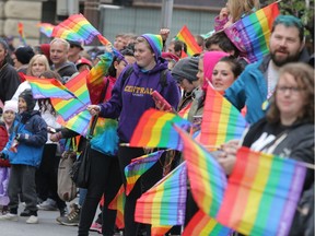 Spectators watch the 2015 Calgary Pride parade. This year's parade goes on Sept. 3.