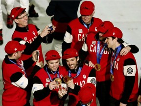 Team Canada athletes, including men's hockey  captain Sidney Crosby (right), at the closing ceremonies for the Sochi 2014 Winter Olympics.
