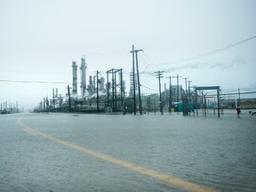 A view of the Marathon Texas City Refinery as rain from Hurricane Harvey floods a road on August 26, 2017 in Texas City, Texas.