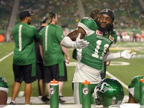 Saskatchewan Roughriders defensive back Ed Gainey reacts to congratulations after recovering a fumble during second half CFL action against the B.C. Lions, in Regina on Sunday, August 13, 2017. Gainey has plenty of time to relish his record-setting performance.Gainey had a club-record four interceptions Sunday in leading the Saskatchewan Roughriders past the B.C. Lions 41-8 at Mosaic Stadium. THE CANADIAN PRESS/Mark Taylor ORG XMIT: CPT105