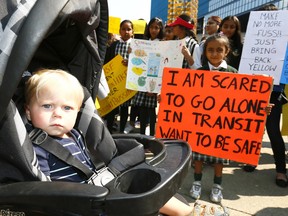 Dresden Bohn,1, was among over 100 parents and kids upset with the Calgary Board of Educations (CBE) new busing policy held a rally in front of Calgary City Hall on Tuesday August 15, 2017. Darren Makowichuk/Postmedia