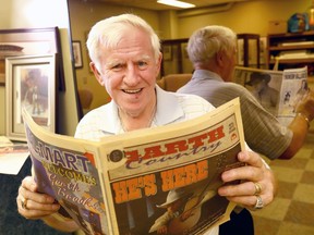 Frank Sisson with some of his newspaper clippings on Garth Brooks as he was the first one to bring the country great to Canada.