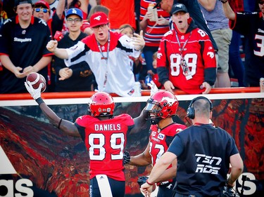 Calgary Stampeders DaVaris Daniels celebrates after his touchdown with teammate Juwan Brescacin against the Toronto Argonauts during CFL football on Saturday, August 26, 2017. Al Charest/Postmedia