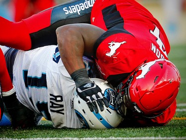 Toronto Argonauts quarterback Ricky Ray is sacked by Micah Johnson of the Calgary Stampeders during CFL football on Saturday, August 26, 2017. Al Charest/Postmedia ORG XMIT: POS1708262136414475