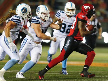Calgary Stampeders Jerome Messam runs the ball against the Toronto Argonauts during CFL football on Saturday, August 26, 2017. Al Charest/Postmedia