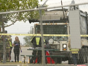A pedestrian was struck and killed by a garbage truck in the 2900 block of 26th Street N.E. on Friday.