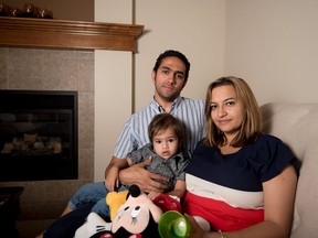 Verginia Ghobrial Said with her husband Ramez Said and son Sebastian, 1, at their home in Calgary on Wednesday, Aug. 23, 2017. (Photo by Yasmin Mayne)