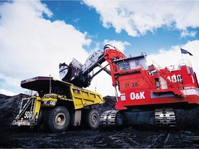 Trucks gather oilsands ore at Syncrude's Aurora site near Fort McMurray.