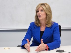 FILE - In this Wednesday, March 2, 2016, file photo, Kathleen Murphy, president of Fidelity Personal Investing, a unit of Fidelity Investments, talks during an interview with The Associated Press, in New York. Many men and women think men are the better investors. They‚Äôre wrong. ‚ÄúWhen women actually take the step of investing, they do a good job,‚Äù says Murphy. (AP Photo/Mark Lennihan, File)