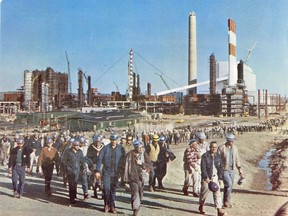 Workers gather outside the Great Canadian Oil Sands plant as it nears completion. Canada's first commercial oilsands plant opened on Sept. 30, 1967. Photo courtesy Suncor