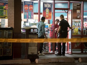 Calgary police attend the scene of a serious stabbing on Friday, Sept. 1 2017 at the Mac's on 61 Ave. near 1A St. S.W.