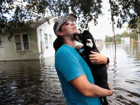 Southeast Texas Inundated After Harvey Makes Second Pass Over The Region

ORANGE, TX - SEPTEMBER 02:  Marine veteran Megan Lowry with the Wounded Veterans of Oklahoma helps to rescue a puppy from a flooded home after torrential rains pounded Southeast Texas following Hurricane and Tropical Storm Harvey causing widespread flooding on September 2, 2017 in Orange, Texas. Harvey, which made landfall north of Corpus Christi August 25, has dumped nearly 50 inches of rain in and around areas Houston.  (Photo by Scott Olson/Getty Images)
Scott Olson, Getty Images