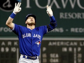 Josh Donaldson of the Toronto Blue Jays celebrates after hitting a home run against Chris Sale of the Red Sox during the first inning at Fenway Park in Boston on Tuesday night.