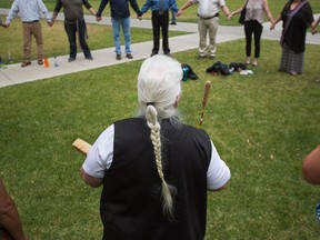 Relatives of a sexual assault victim of  Wayne Howard Bernard perform a healing song in Courthouse Park in downtown Calgary, AB Friday September 8th, 2017. Andy Nichols/Postmedia

Postmedia Calgary
Andy Nichols, Andy Nichols/Postmedia