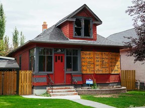 Sunnyside house that went up in flames on April 8 is boarded up with an account of its tenants over the years.