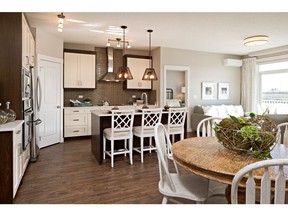 The kitchen and dining area in the show suite at Auburn Rise in Auburn Bay.