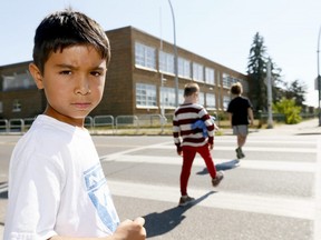 Rah Wilkens,8, who will be starting Garde 3 Tuesday morning wants Calgarians to remember kids are heading back to school on Monday September 4, 2017. Darren Makowichuk/Postmedia