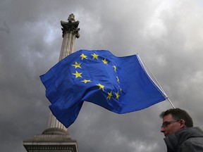Protesters wave European flags in Trafalgar square during a rally in central London on Sept. 13 to warn about the terms of Brexit.