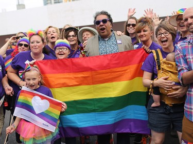 Calgary Mayor Naheed Nenshi poses with supporters during the Calgary Pride Parade on Sunday September 3, 2017.