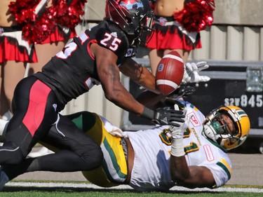 The Calgary Stampeders' Tommie Campbell helps stop the Edmonton Eskimos' D'haquille Williams  from making this catch in the end zone during the second half of the Labour Day Classic at McMahon Stadium, Monday September 4, 2017.