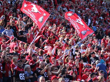 Calgary Stampeders fans cheer their team after they beat the Edmonton Oilers 39-18 in the Labour Day Classic at McMahon Stadium, Monday September 4, 2017.