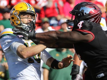 The Calgary Stampeders' Micah Johnson goes after Edmonton Eskimos quarterback Mike Reilly during the second half of the Labour Day Classic at McMahon Stadium, Monday September 4, 2017.