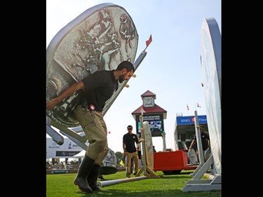 Course workers set up jumps in the International Ring for the Spruce Meadows Masters on Tuesday September 5, 2017. Competition begins Wednesday.