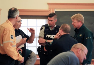 Emergency officials meet at the community centre in Waterton Alberta on Wednesday September 6, 2017 before updating town residents. There is a voluntary evacuation order for the town and surrounding National Park. Residents and visitors in the townsite were warned they could be evacuated with an hours notice if a large fire in B.C. moves closer.
Gavin Young/Postmedia