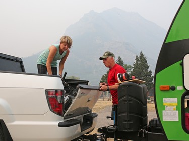 Ken and Ruth Nass from Saskatchewan pack up in the nearly empty Waterton townsite campground  on Wednesday September 6, 2017. The town is currently under a voluntary evacuation order that could be changed to a mandatory order with 1 hours notice. A large wildfire is on the edge of Waterton National Park and threatens the town.