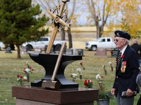 Veteran Ronald Beirnes takes a look at the Anvil of Peace memorial at Mountain View Memorial Gardens following its rededication ceremony on Saturday Morning September 30, 2017. The original memorial was stolen from the Field of Honour area at Mountain View in 2015. Gavin Young/Postmedia