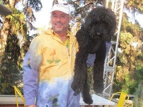 More than 1,000 guests gathered in the gardens of  W. Brett Wilson's Mount Royal estate for his annual garden party-held this year Sept 6. Pictured is the host with the most and his faithful companion J. Cash. Funds raised this night supported 9 charitable organizations with a focus on mental health.