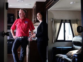Shannon Phillips, Alberta Environment and Parks Minister tours an RV with Keith Hanks, president of Affordable RV Sales & Service following an announcement she made about Alberta's late-season camping opportunities on Tuesday, September 5, 2017. Kerianne Sproule/Postmedia