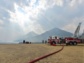 Calgary fire trucks stationed outside the historic Prince of Wales hotel in Waterton Lakes National Park in southwest Alberta on Saturday, Sept. 9 2017. As a wildfire approaches the national park, Calgary fire crews have been entrusted with keeping the 90-year-old hotel -- a national historic site -- from harm. Bryan Passifiume/Postmedia Network