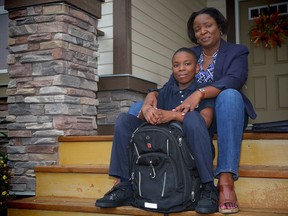 Amory Hamilton-Henry with her 10-years-old son Brandon Henry, pose for a photo on the front steps of their Skyview home. Hamilton-Henry is part of a group of northeast Calgary parents, that have pooled their resources and hired a private school bus service, paying more than $1,000 each to get their kids to school safely rather than face lengthy public transit commutes of two buses and a CTrain each way.