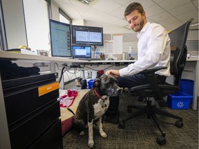 David Leonard, and his dog Riley at work at Entuitive Corp. in Calgary,