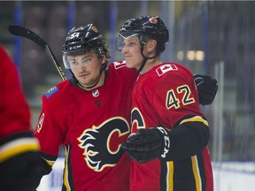 Calgary Flames Juuso Valimaki (42) celebrates with teammate Rasmus Andersson after scoring agains the Edmonton Oilers during the NHL Young Stars Classic hockey action at the South Okanagan Events Centre in Penticton, BC, September, 8, 2017.