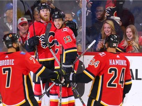 Calgary Flames Johnny Gaudreau celebrates with teammates after scoring against the Arizona Coyotes in NHL pre-season hockey at the Scotiabank Saddledome in Calgary on Friday, September 22, 2017. Al Charest/Postmedia