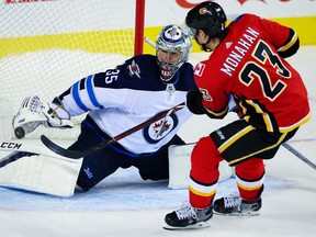 Flames star Sean Mohanan scores on Jets goalie Steve Mason to wrap up the Flames' 2017 pre-season slate Saturday night at the Saddledome. Photo by Al Charest/Calgary Sun.