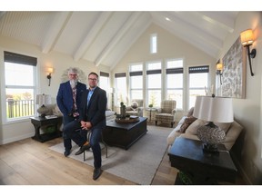 Harry Stepper, chairman of the board for Stepper Homes, and Dave Hooge, president of Stepper Homes, in their award-winning Langdon show home.