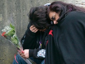 Gladys Radek, a family supporter, right, hugs Patrica Evans, the sister of victim Brenda Wolfe, outside the B.C. Supreme Court in New Westminster, B.C. Tuesday, December 11, 2007. Families delivered their victim impact statements before the sentencing of Robert Pickton who was found guilty in six counts of second-degree murder. Radek is the organizer of an annual walk to honour the Indigenous women who have gone missing or been murdered along the Highway of Tears. THE CANADIAN PRESS/Jonathan Hayward ORG XMIT: CPT500