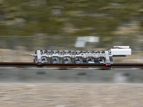 A sled speeds down a track during a test of a Hyperloop One propulsion system in North Las Vegas, Nev., on May 11, 2016. The Toronto-Montreal corridor has taken the prize as one of the strongest candidates in the world for a hyperloop system that could cut travel time between the cities from five hours to just 39 minutes.