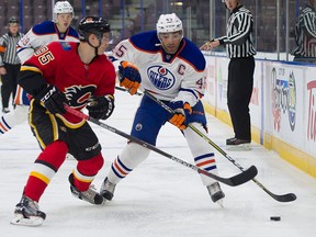 Edmonton Oilers Joe Gambardella tries to get past Calgary Flames Josh Healey during the NHL Young Stars Classic hockey action at the South Okanagan Events Centre in Penticton, BC, September, 8, 2017.