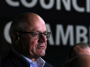 Calgary Flames President and CEO Ken King talks with the media outside Calgary City Council chambers on Monday April 24, 2017. City Council was considering the Calgary Flames arena plan B.