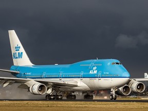 "City of Calgary," a Boeing 747-400 owned by KLM Royal Dutch Airlines, touches down at Schiphol Airport in Amsterdam, the Netherlands on January 24, 2014. Photo courtesy Kelvin Jahae